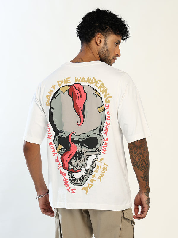 A man wearing a white t-shirt with a large graphic print on the back, featuring a skull with a red streak and gold text, photographed against a plain white background.
